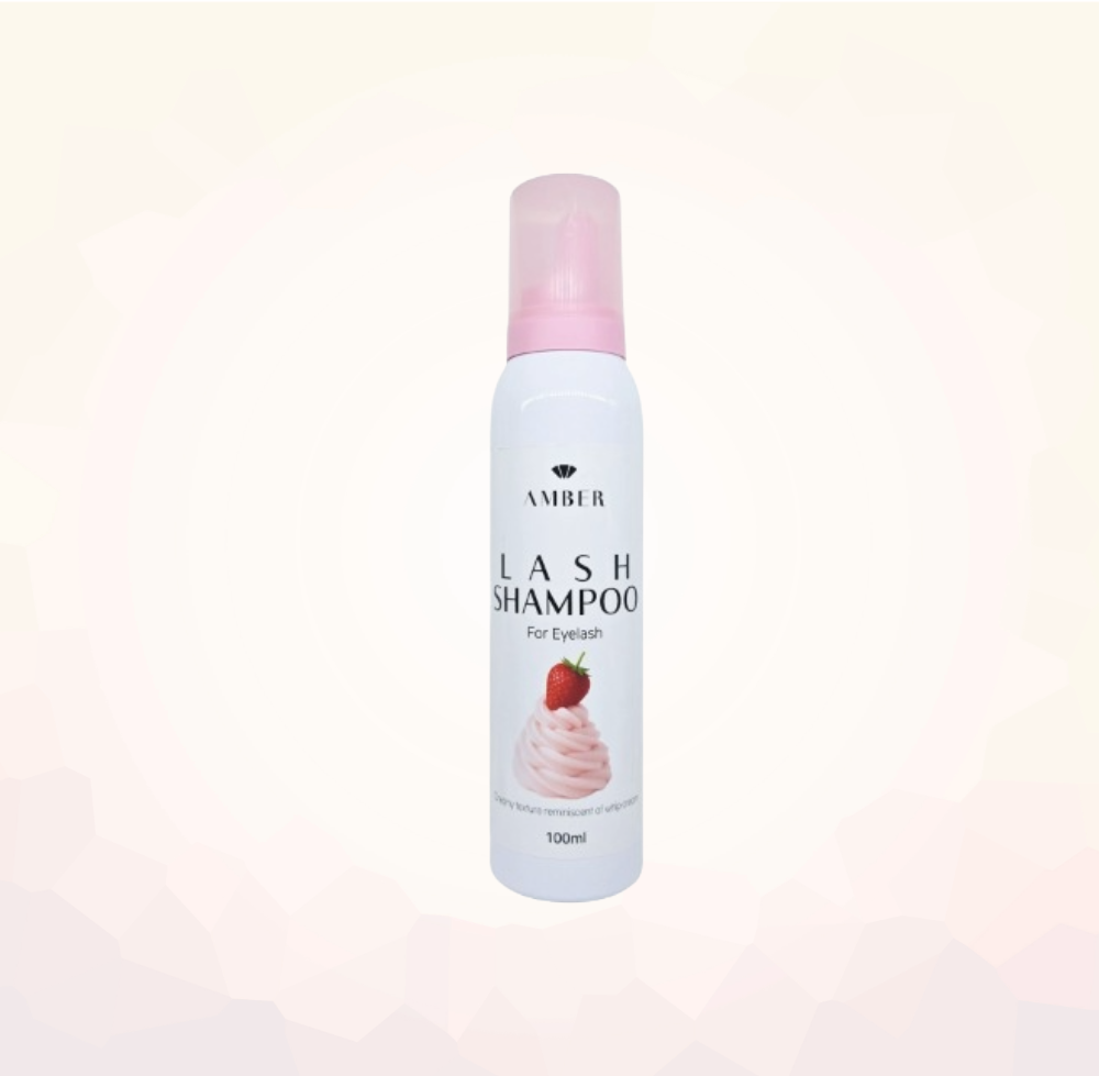 Lash shampoo bottle with pink cap on a light pink background