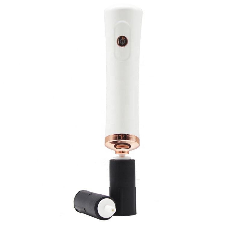 White electric eyelash glue shaker with rose gold trim and interchangeable black silicone bottle sleeves.