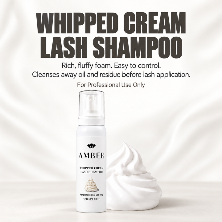 Amber Whipped Cream Lash Shampoo beside a swirl of dense white foam for professional lash cleansing and prep.