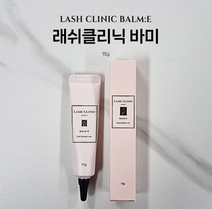 Lash Clinic BALM:E 15 g tube and matching pink box on a light gray background.